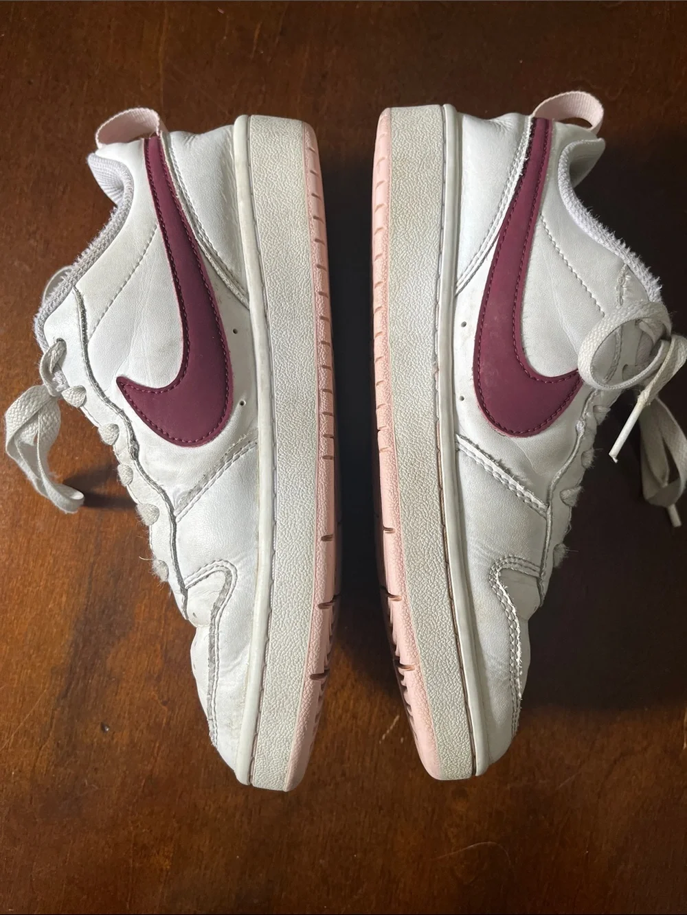 Nike Kids White Sneakers with Maroon Swoosh and Light Pink Details